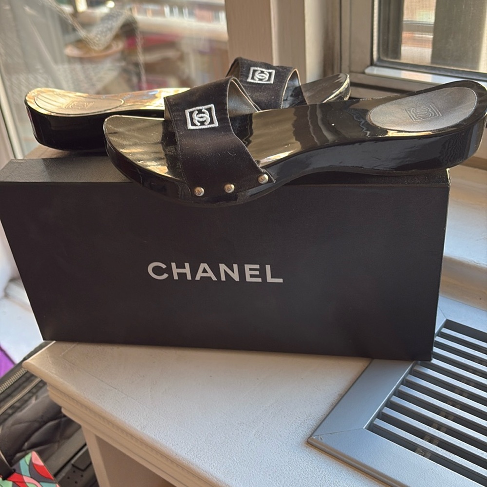 Like new Black Chanel Mule wood base

With White Logo.